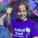Freddie, aged 10, holding the 16-inches of hair he will be donating. Freddie has been growing his hair for four years for this fundraiser.