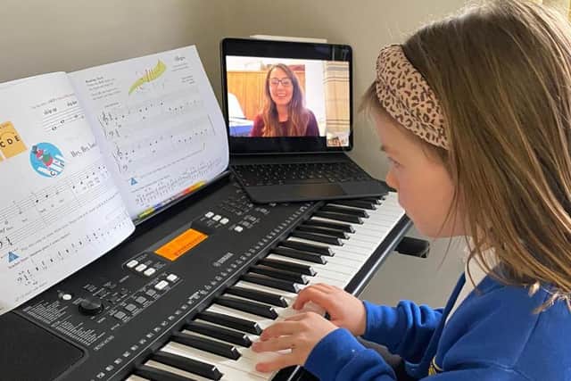 An AS Music School pupil attends a virtual one-on-one tuition session