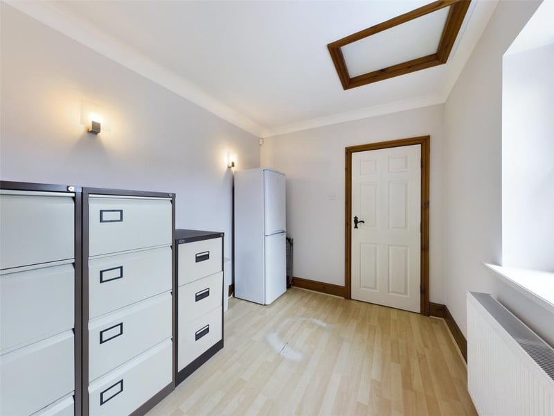 Sealed unit double glazed window to the front elevation, with wood effect laminate flooring. With access to roof space, and internal door to garage.