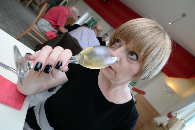 Helen MacKenzie casting an expert eye and nose over champagne at Baldwins Omega restaurant, Brincliffe Hill, Sheffield