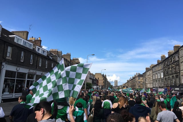 Thousands of Hibs fans follow the open-top bus down Leith Walk the following day