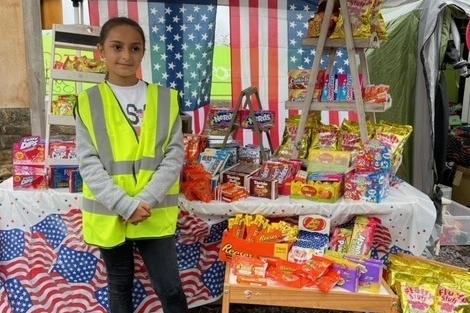 American sweets stall is an attraction for this youngster.