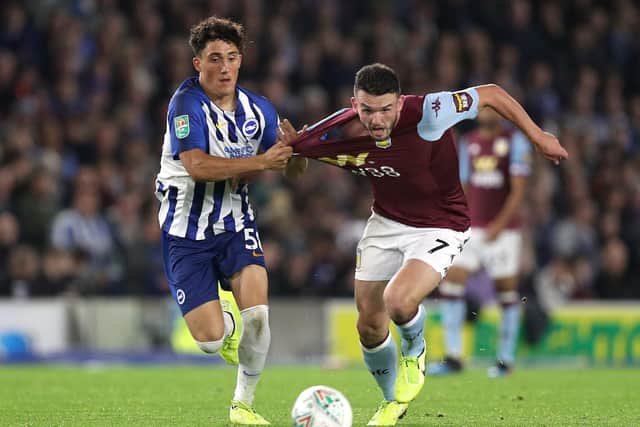 Brighton and Hove Albion's Haydon Roberts (left) is a transfer target for Sheffield Wednesday.