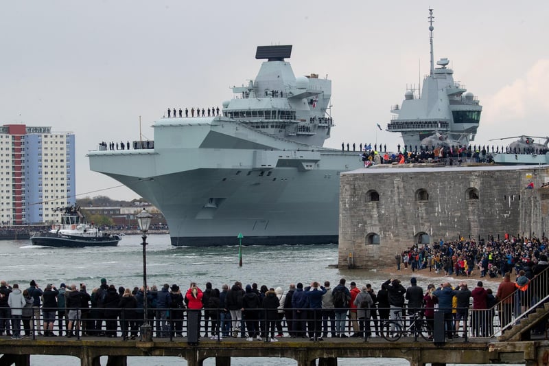 The Royal Navy aircraft carrier HMS Queen Elizabeth passes the Round Tower as it leaves Portsmouth Naval Base. Picture: Andrew Matthews/PA Wire