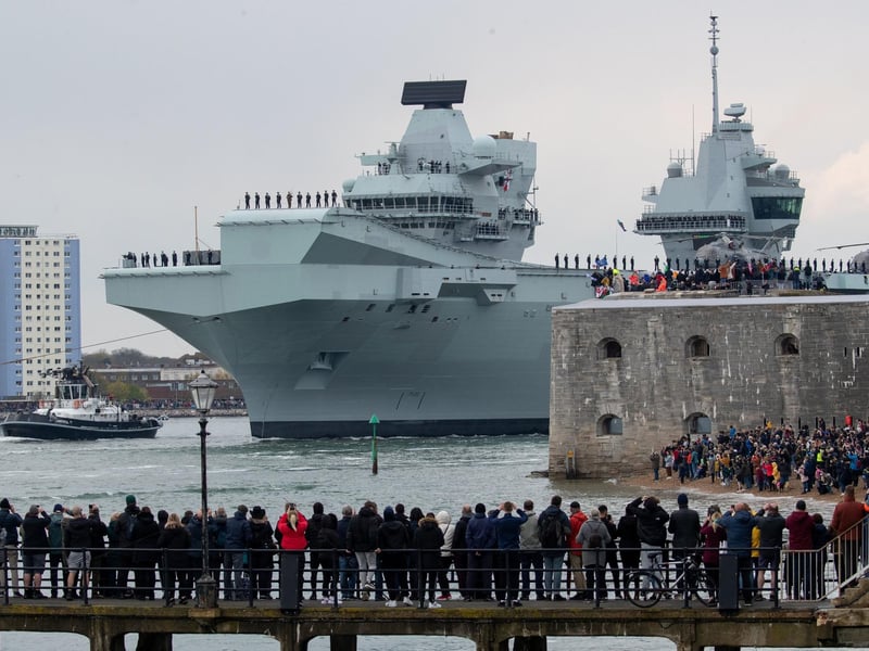 The Royal Navy aircraft carrier HMS Queen Elizabeth passes the Round Tower as it leaves Portsmouth Naval Base. Picture: Andrew Matthews/PA Wire