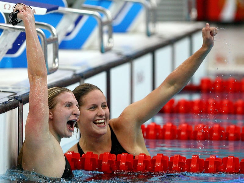 Rebecca Adlington celebrates winning the 400m Freestyle Final with third placed Joanne Jackson.