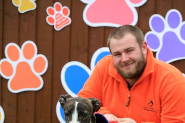 Staff and animals at Rain Rescue to help promote their mother's day plaques they are offering this year to help them through the pandemic financially. Pictured is Mcihael Heredge with Lilly.
Picture: Chris Etchells