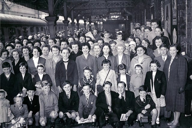 Staff and their families from the John Banner store, Attercliffe, at Sheffield Victoria Railway Station on their annual day trip to the seaside in 1958