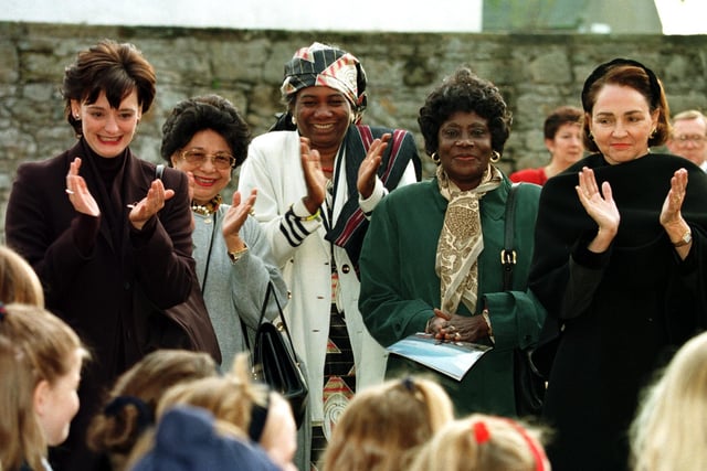 Cherie Blair and other wives of the Commonwealth leaders applaud a group of primary school children who sang fior them at Culross.