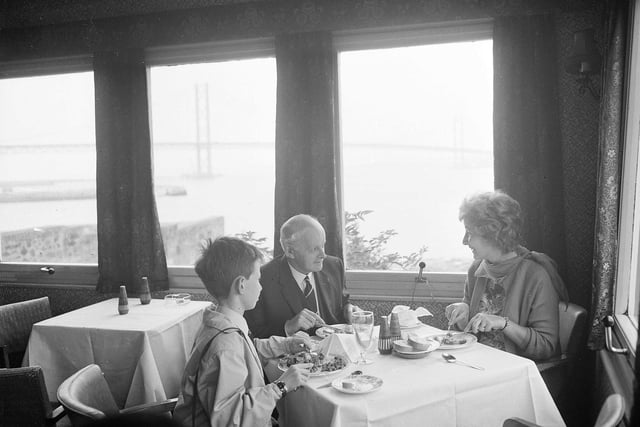 Diners enjoy a view of the Forth Road Bridge from the South Queensferry Hotel in September 1964.