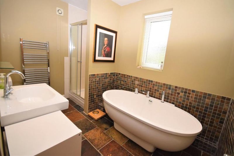 The family bathroom includes a quality suite comprising a large double-end bath and separate shower cubicle. There is  also a low-flush WC, wash basin and central-heated towel-rail.