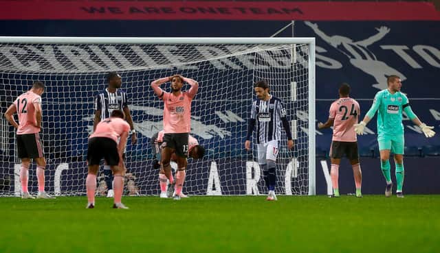 Sheffield United players despair as another chance is missed against West Brom at the Hawthorns tonight. (JASON CAIRNDUFF/POOL/AFP via Getty Images)