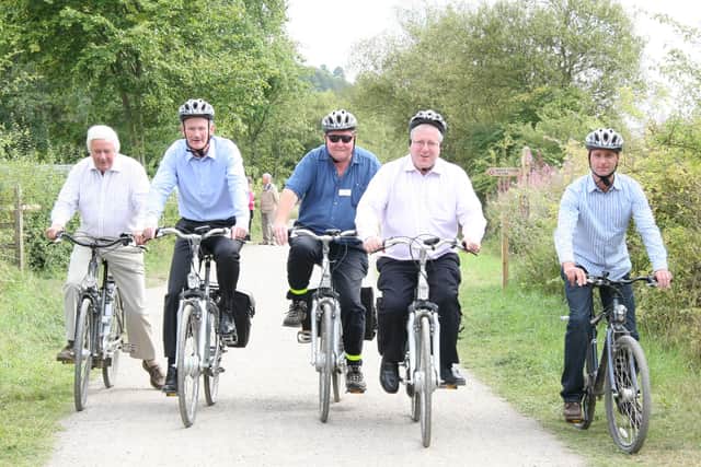 And They're Off: Tony Favell of the Peak District National Park, Minister for Tourism and Heritage John Penrose, Geoff Nickolds of Peak District National Park, MP Patrick McLoughlin and Hassop Station owner Duncan Stokes set off on the Monsal Trail for Litton Mill. is shown one of the electric bikes by owner Duncan Stokes at Hassop Station Cycle Hire back in 2011