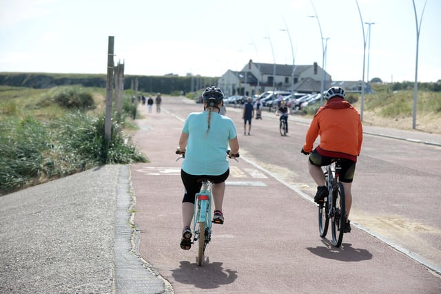 Cyclists enjoy a ride along the seafront at Sandhaven Beach in South Shields.