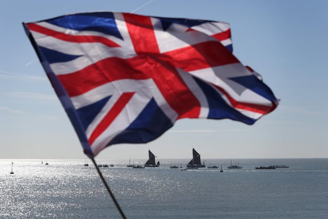 'Little Ships' are seen under a Union flag as they depart in May 21, 2015. (Photo by Peter Macdiarmid/Getty Images)