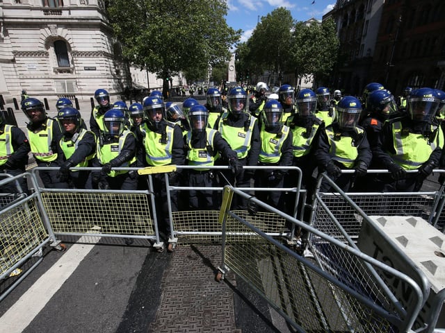 Police form a barricade in Parliament Square. Picture: Jonathan Brady/PA Wire
