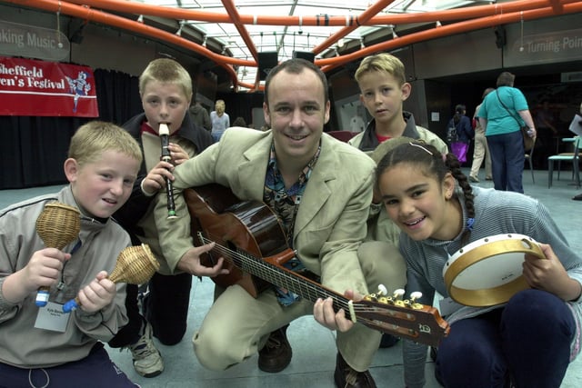 Rikki Thomas-Martinez with youngsters at a music-making event, part of the Sheffield Children's Festival in 2002 after the museum shut.