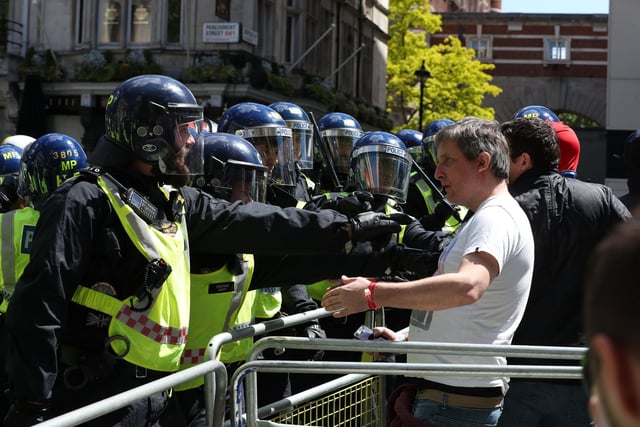 Police are confronted by protesters in Whitehall near Parliament Square. Picture: Jonathan Brady/PA Wire