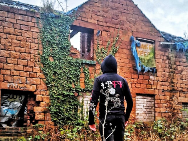 Lost Places & Forgotten Faces checks out the abandoned mill - complete with 'danger, keep out' sign in a top window.