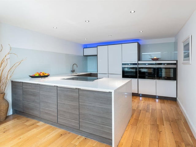 The kitchen has plenty of storage space and modern appliances.