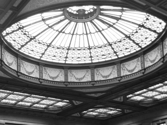 The interior of which famous Edinburgh building boasts this beautiful glass roof?