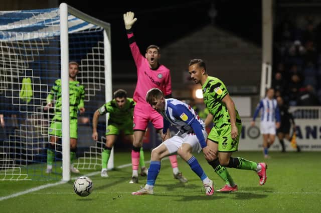 Hartlepool United's Matty Daly battles with Forest Green's Kane Wilson  during the Sky Bet League 2 match between Hartlepool United and Forest Green Rovers at Victoria Park, Hartlepool on Saturday 20th November 2021. (Credit: Mark Fletcher | MI News)