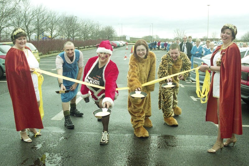 On their marks at The Galleries! Karen Robson, left, and Lesley Pugh, right of the Millennium Cancer Appeal, at Savacentre were pictured at the start of a 2000 pancake race with, left to right, Gordon Tarm and Gordon Smith, of Savacentre, and Joanne Etherington and Steven McKenna, of Asda.