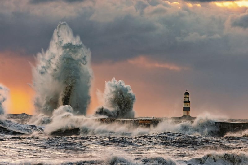 Waves crash against the pier at Seaham in Phil's photographs.