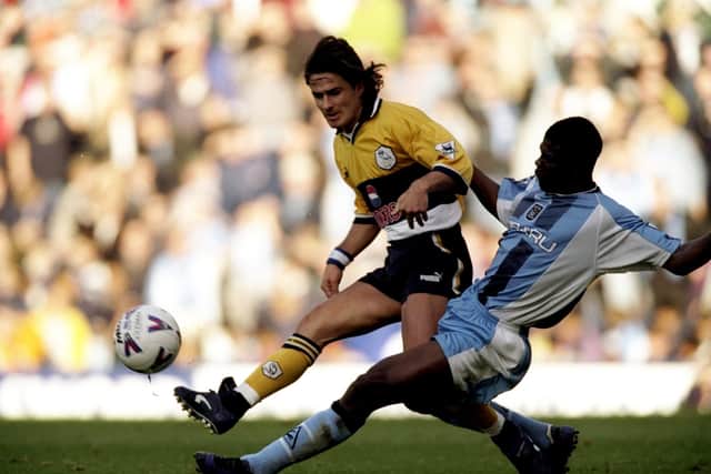 Benito Carbone of Sheffield Wednesday is challenged by George Boateng of Coventry during the FA Carling Premiership match played in Coventry. Phil Cole /Allsport