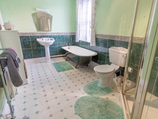 The ground-floor extension also includes this shower room. Bath, wash hand basin, WC and walk-in shower - they're all here.