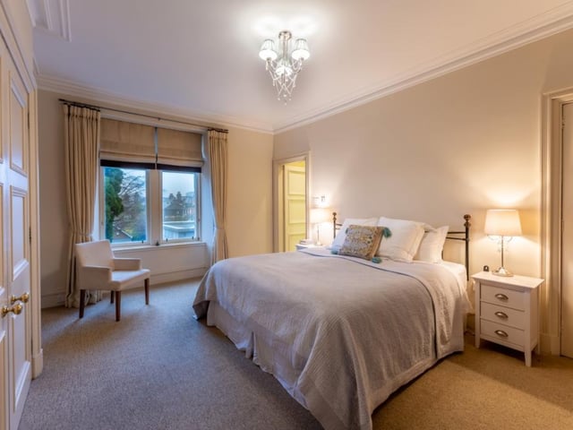 With a rear aspect overlooking the garden, the principal bedroom has wall-to-wall fitted wardrobes incorporating extensive hanging and shelf space.