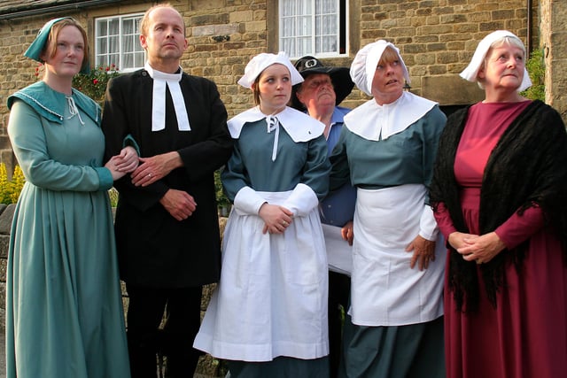 The cast  of the 2009 Eyam Plague Play in front of the plague cottage