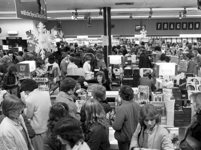 Christmas shoppers in the usual last-minute rush - the cosmetic/perfume department of Princes Street branch of Boots Edinburgh, December 1983.