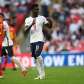 Bukayo Saka of England celebrates after scoring their team's fourth goal during the 2022 FIFA World Cup Qualifier match between England and Andorra at Wembley Stadium on September 05, 2021 in London, England. (Photo by Shaun Botterill/Getty Images)