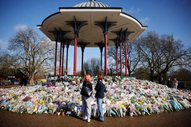 Floral tributes and messages in honour of Sarah Everard at the bandstand on Clapham Common in south London