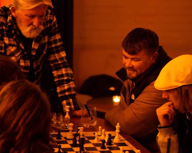 Chess and Tunes regulars enjoying their game and company