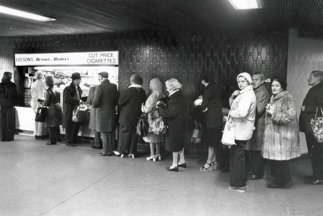 Beat the budget -queue outside a cigarette kiosk in Sheffield's Hole in the Road on Budget Day - 29th March 1977