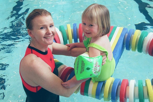Pictured at Chapeltown Swimming pool in 2000 during a swimming lesson for babies . Seen is Sheila McGill who runs the lessons with one of the young pupils.