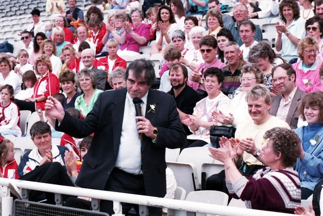 Fiery Freddie Trueman conducts the brass band and the crowd in a rousing chorus of Ilkley Moor Baht'at at the Yorkshire Day celebrations at Don Valley Stadium on August 1, 1993