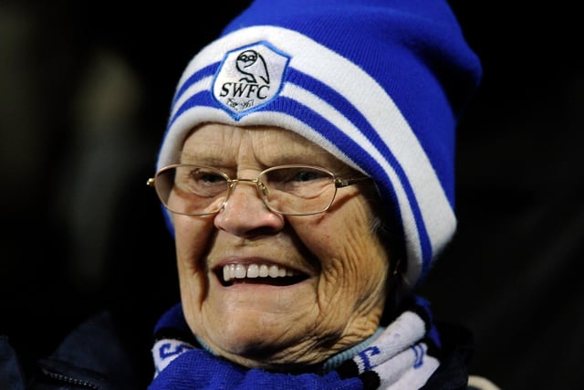 A Wednesday fan is all smiles as she watches her side beat MK Dons 4-1 in November 2010.