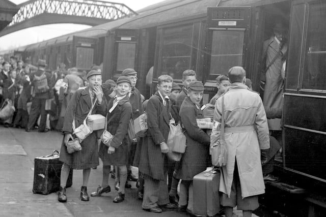 Here are some older children saying goodbye to Sunderland as they get on the train at Monkwearmouth Station to be evacuated.