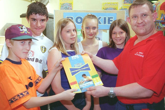 Youngest recepient  of the  1999 LIfe Guards award at the St James Swimming Pool ,Watergate Doncaster  Kieron  Lacey   pictured receiving his certificate from Instructor Mick Calver. Looking on are other award winners Matthew Godley,Lauren McMullen,Cassandra Kirby and Sally Hayes.