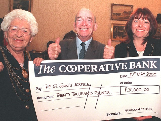 At the Mansion House Doncaster the Mayor's charity fund raised at least £20,000 for the St John's Hospice in 2000, pictured from the left Mayor Cllr Margaret Robinson, Lord Walker honorary president of the hospice accepted the cheque, Mayoress Janet Rivett.