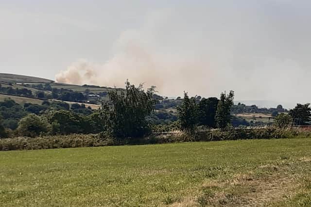 A large fire has engulfed Sheffield grassland on Monday afternoon.