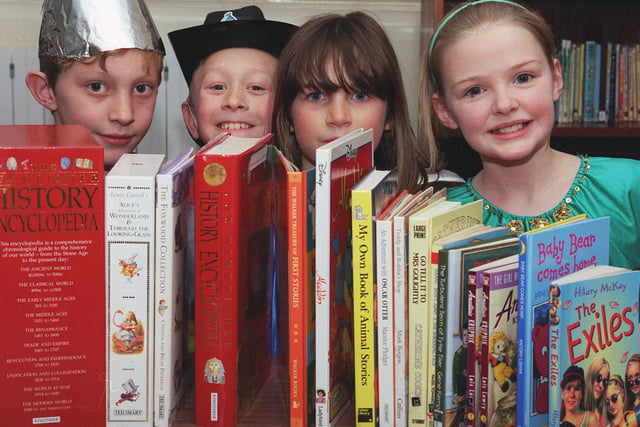 Park Primary School pupils, from left, Gareth Hunter, aged nine, Ashley De-Viell, aged eight, Roxanne Jones and Rebecca Green, both aged nine, chose a book to read in 2000