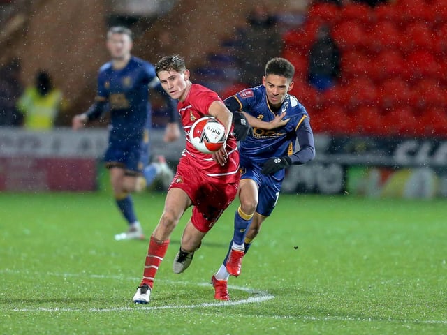 Mansfield Town forward Tyrese Sinclair fights for possession.
