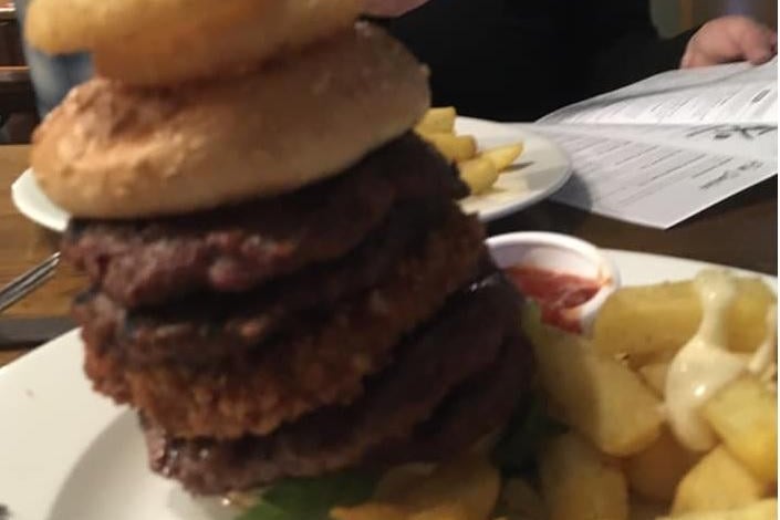 Barry Barlow posts this photo of a whopping burger, saying: "Oozy floozy. Six Halts."