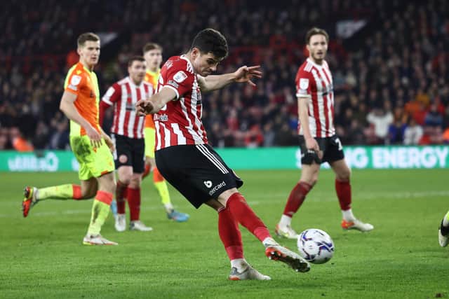 John Egan fires in a cross during the league meeting between Sheffield United and Nottingham Forest at Bramall Lane this season.