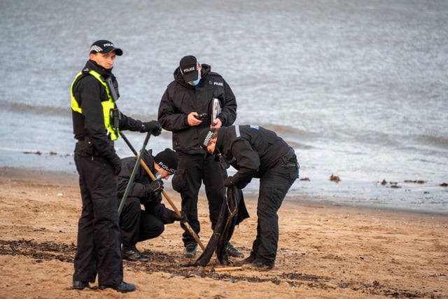 A line of officers were seen combing the sand at Portobello beach for clues to where Alice may have gone. A resident reported seeing them uncover a black cardigan, which he said showed the amount of "evidence" they would have to go through as part of the search.