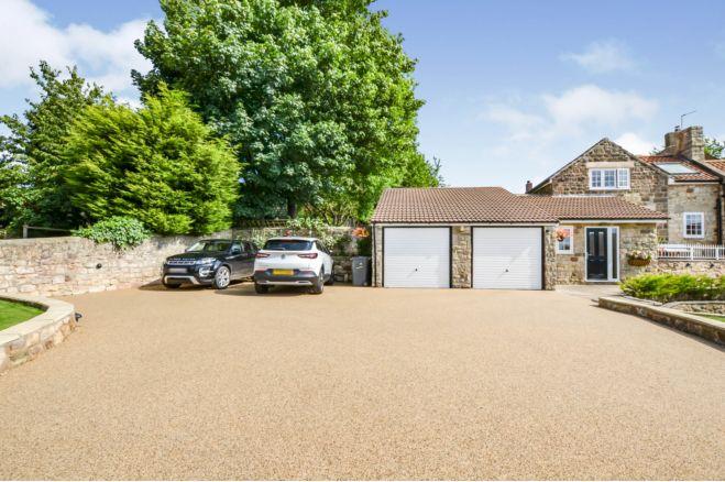 At the front of the house is a remote controlled electric security gate which leads onto the driveway to the property. The resin driveway leads to a double garage which has up and over doors, power, light and a pit. The double garage can also be accessed via the front entrance hallway.